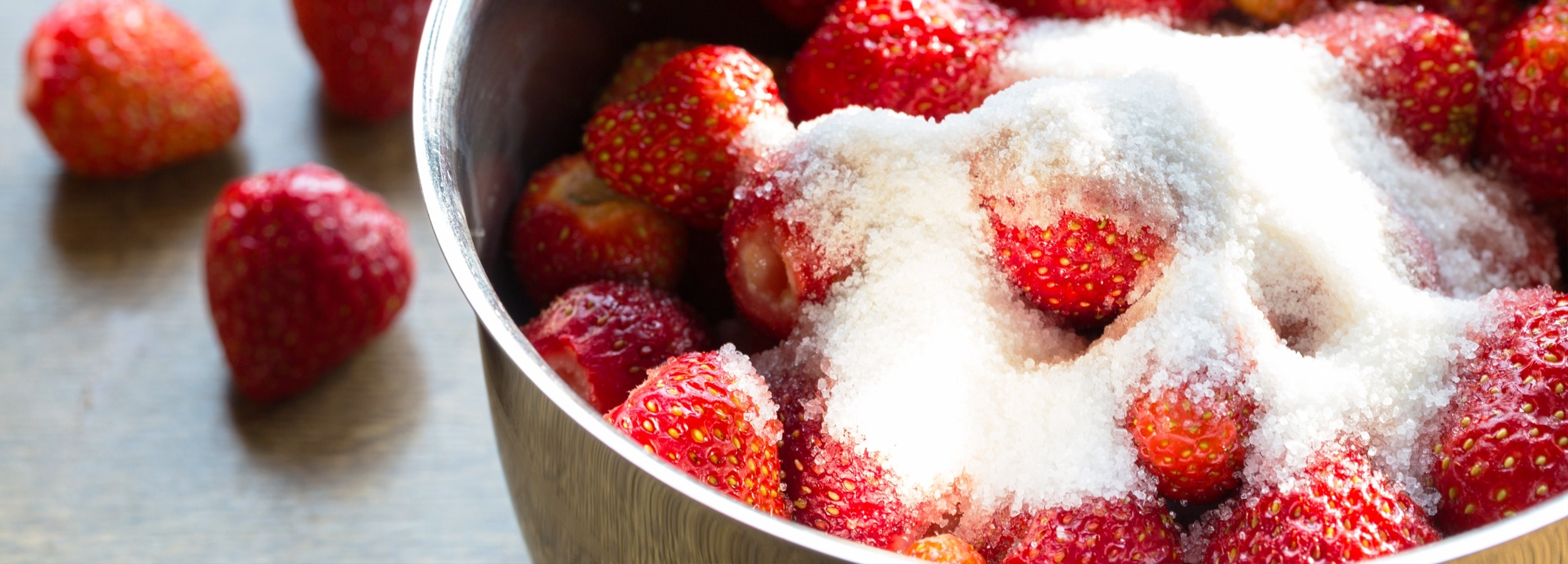 Strawberries in a bowl with sugar